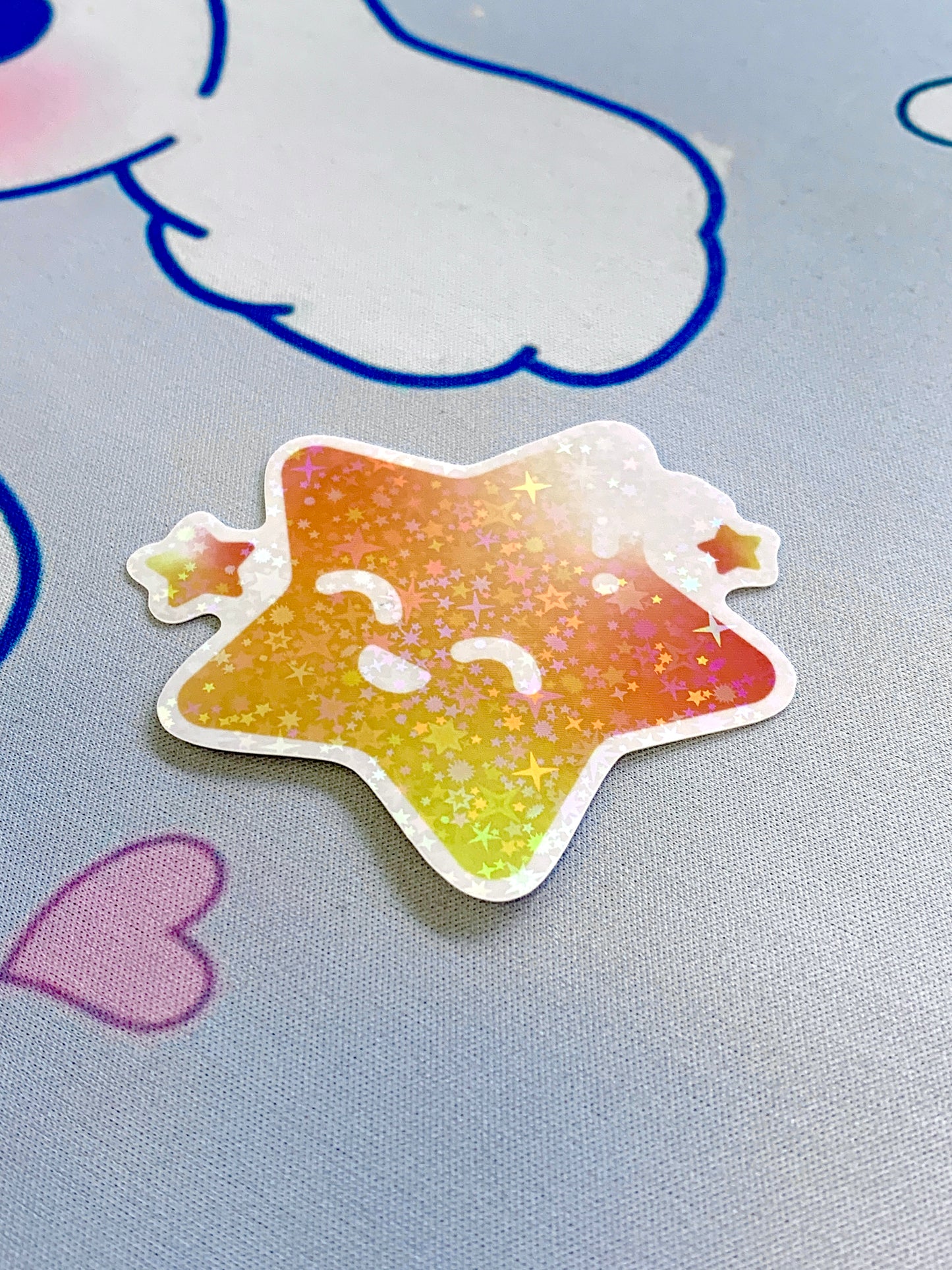 Gradient star-shaped sticker on a light blue cinamoroll background